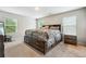 Bright bedroom featuring a king-size bed and plenty of natural light at 3811 River Rock Rd, Lithonia, GA 30038