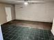 Basement area with tile flooring and natural light from exterior door at 860 Flat Shoals Rd, Atlanta, GA 30349