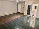Bedroom features both tile and carpet flooring with neutral wall colors and an attached bathroom at 860 Flat Shoals Rd, Atlanta, GA 30349