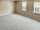 Comfortable bedroom with carpet, neutral paint and a view to the backyard at 860 Flat Shoals Rd, Atlanta, GA 30349