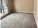 Spacious living room with carpet and a large window letting in natural light at 860 Flat Shoals Rd, Atlanta, GA 30349