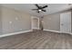 Bright bedroom with hardwood floors and ceiling fan at 445 Milton Dr, Canton, GA 30114