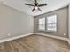 Bedroom with ceiling fan and wood-look flooring at 445 Milton Dr, Canton, GA 30114