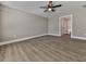 Spacious bedroom with ceiling fan and wood-look flooring at 445 Milton Dr, Canton, GA 30114