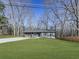 Ranch style home with gray siding and a wood front porch at 445 Milton Dr, Canton, GA 30114