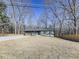 Gray house with dark roof and a long driveway at 445 Milton Dr, Canton, GA 30114