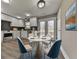 Modern eat-in kitchen with white cabinets, a breakfast bar, and French doors leading to the deck at 445 Milton Dr, Canton, GA 30114