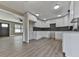 Modern kitchen with white shaker cabinets, granite countertops, and dark tile backsplash at 445 Milton Dr, Canton, GA 30114
