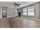 Hardwood floors and neutral walls characterize this spacious living room at 445 Milton Dr, Canton, GA 30114