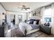 Spacious primary bedroom with a king-size bed and private access to a deck at 7650 Homer Dr, Cumming, GA 30028