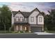 Two-story farmhouse-style home with stone and siding accents at 7650 Homer Dr, Cumming, GA 30028