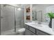 Modern bathroom with gray tile shower and vanity at 1346 Auburn Glen Rd, Dacula, GA 30019