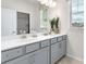 Bright bathroom with double sinks, large mirrors and plenty of storage below the counter at 1346 Auburn Glen Rd, Dacula, GA 30019