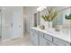 Spa-like bathroom with double vanity, large mirror, and walk-in shower at 1346 Auburn Glen Rd, Dacula, GA 30019