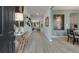 Inviting entryway showcasing decor, light wood floors, and an open floor plan to the living spaces at 1346 Auburn Glen Rd, Dacula, GA 30019