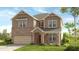 Two-story brick house with a large front yard and attached garage at 1346 Auburn Glen Rd, Dacula, GA 30019