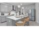 Stylish kitchen with an island, stainless steel appliances, and shaker cabinets at 1346 Auburn Glen Rd, Dacula, GA 30019