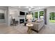Bright living room with a fireplace, lots of light and a neutral color scheme at 1346 Auburn Glen Rd, Dacula, GA 30019