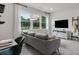 Comfortable second living area features a couch, media center and lots of light at 1346 Auburn Glen Rd, Dacula, GA 30019