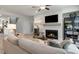 Comfortable living room with a fireplace, modern furnishings, and access to the staircase at 1346 Auburn Glen Rd, Dacula, GA 30019