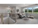 Upstairs loft area is carpeted and includes a lounge area with natural light at 1346 Auburn Glen Rd, Dacula, GA 30019