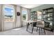 Well-lit office with a modern desk, shelving, and a view of the community outside at 1346 Auburn Glen Rd, Dacula, GA 30019