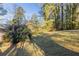 Large backyard with spacious lawn and mature trees at 2230 Star Mist Sw Dr, Atlanta, GA 30311