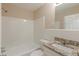 Updated bathroom with granite countertop and a shower/tub combo at 2230 Star Mist Sw Dr, Atlanta, GA 30311