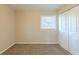 Simple bedroom with neutral walls, carpet, and a window with blinds at 2230 Star Mist Sw Dr, Atlanta, GA 30311