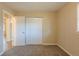 Cozy bedroom with neutral walls, carpet and double door closet at 2230 Star Mist Sw Dr, Atlanta, GA 30311