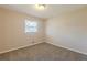 Bedroom with pegboard accent wall, carpet, and ample closet space at 2230 Star Mist Sw Dr, Atlanta, GA 30311