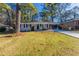 Ranch style home with carport, freshly paved driveway and well manicured lawn at 2230 Star Mist Sw Dr, Atlanta, GA 30311
