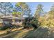 Ranch-style home exterior with a spacious backyard at 2230 Star Mist Sw Dr, Atlanta, GA 30311