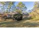 Back exterior view of a ranch home showcasing landscaping at 2230 Star Mist Sw Dr, Atlanta, GA 30311