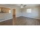 Living room with ceiling fan and open concept to kitchen at 2230 Star Mist Sw Dr, Atlanta, GA 30311
