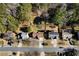 Aerial view of a residential neighborhood with houses and tree-lined streets at 230 Bennett Farms Trl, Acworth, GA 30102