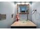 Small bathroom with glass sink, modern faucet, and framed mirror at 230 Bennett Farms Trl, Acworth, GA 30102