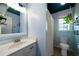 Clean bathroom with light blue walls, a shower/tub combo, and a white vanity at 230 Bennett Farms Trl, Acworth, GA 30102