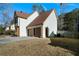 Two-story house with attached two-car garage and wood-toned doors at 230 Bennett Farms Trl, Acworth, GA 30102