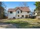 Two-story house with white siding, brown roof, and a backyard patio at 230 Bennett Farms Trl, Acworth, GA 30102