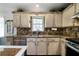 Spacious kitchen featuring granite countertops, stainless steel appliances, and updated cabinetry at 230 Bennett Farms Trl, Acworth, GA 30102