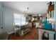 Eat-in kitchen with hardwood floors, white cabinets, and granite countertops at 230 Bennett Farms Trl, Acworth, GA 30102