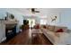 Spacious living room with hardwood floors, fireplace, and large windows at 230 Bennett Farms Trl, Acworth, GA 30102
