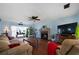 Living room featuring hardwood floors, fireplace, and comfortable seating at 230 Bennett Farms Trl, Acworth, GA 30102