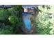 Aerial view of the property showcasing the in-ground pool and lush surroundings at 515 Lees Sw Trce, Marietta, GA 30064
