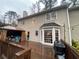 Expansive wooden deck featuring a gazebo and grill, perfect for outdoor entertaining, with a view of the home's exterior at 515 Lees Sw Trce, Marietta, GA 30064
