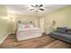 Bright bedroom features new floors, a ceiling fan, and comfortable furniture at 515 Lees Sw Trce, Marietta, GA 30064