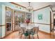 Light and airy dining room features wood trim, hardwood floors, and a large bay window with a view at 515 Lees Sw Trce, Marietta, GA 30064