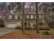 Charming two-story traditional home boasts a 2-car garage and inviting front porch with black shutters at 515 Lees Sw Trce, Marietta, GA 30064