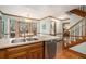 Open kitchen with stainless steel dishwasher, hardwood floors and access to the breakfast nook at 515 Lees Sw Trce, Marietta, GA 30064